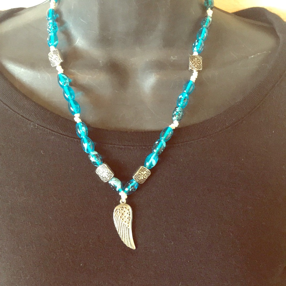 Boho blue Angel wing necklace in silver handmade by Amanda Sanchez